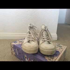All white high top vans
